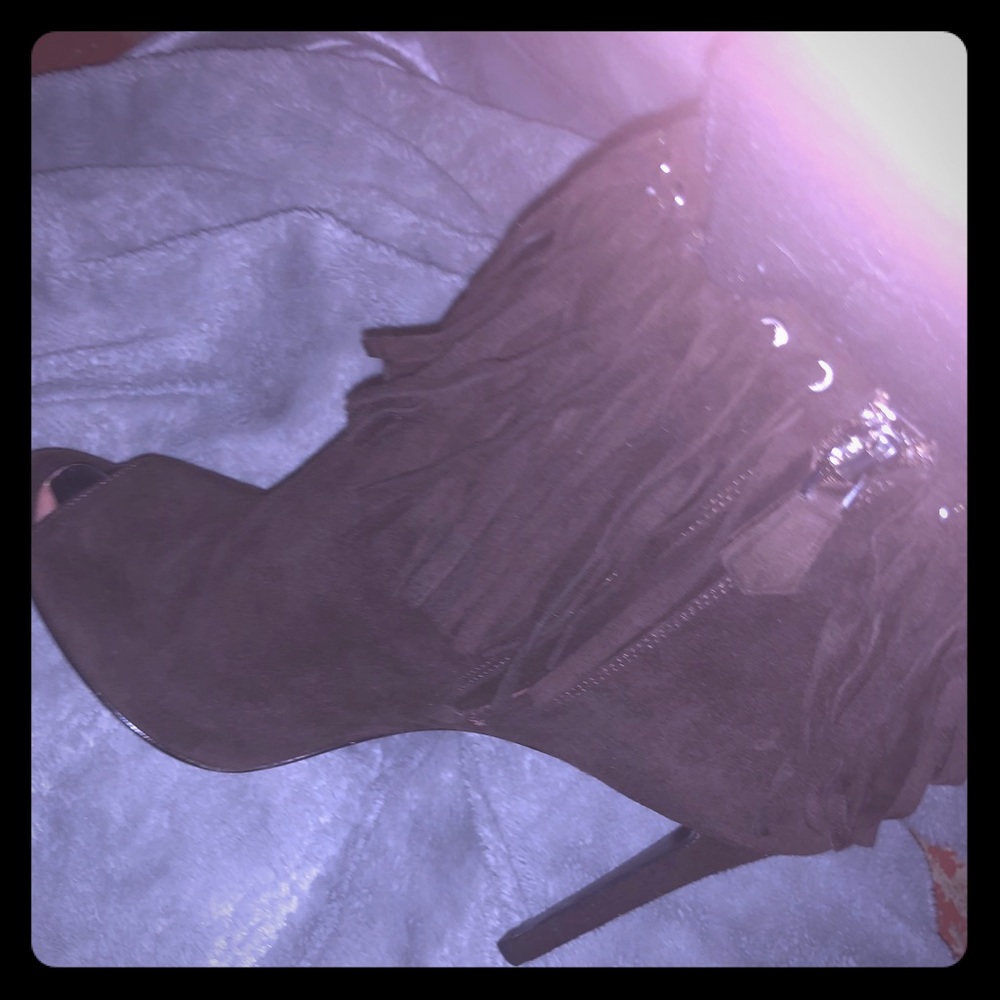 Prada suede peep toe ankle boots with fringes.